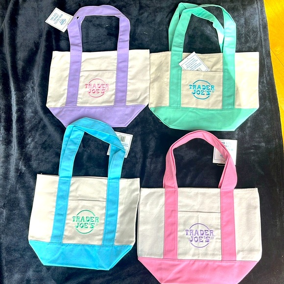 trader joe’s Handbags - Bundle of 4 Trader Joe’s mini tote bags pastel Pink Pirple Mint and Sky